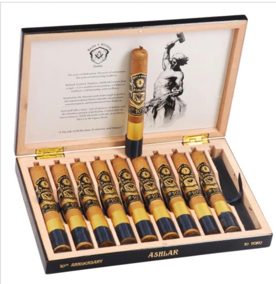Open wooden cigar box with ten cigars neatly lined up; one upright in the center, labeled ASHAR.