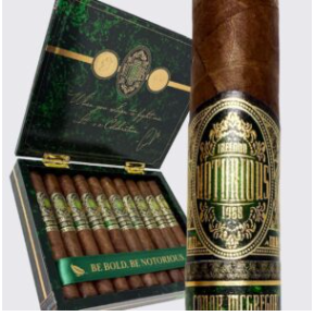Open cigar box with several cigars and a large premium cigar alongside; green band reads 'Be Bold Be Notorious'.