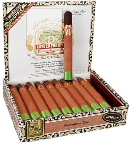 Open cigar box with several cigars arranged in a row and one standing upright; ornate Arturo Fuente branding visible on the lid.