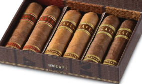 Six cigars laid in a wooden open box, each with decorative bands around the wrappers (assorted flavors).