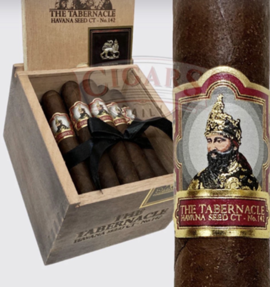 Wooden cigar box with several cigars and a large labeled cigar reading The Tabernacle Havana Seed CT No. 142.