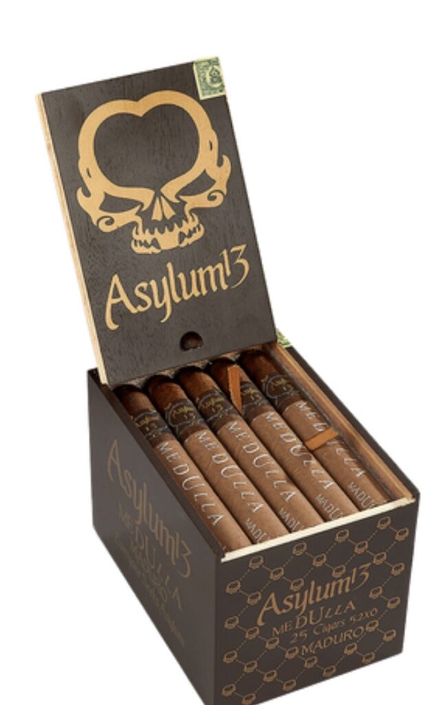 Open black box of Asylum cigars with a gold skull logo on the lid; five brown cigars are arranged inside the box.