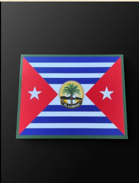 Framed Cuban flag plaque on a dark wall.