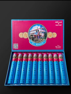 Open pink box labeled El Mago with blue-wrapped cigars neatly lined in a blue interior tray (ten cigars visible).